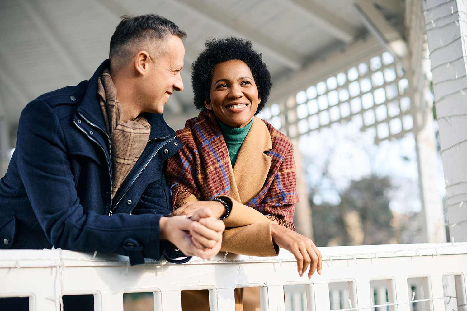 A delightful image captures a happy couple on a porch, featured in a blog discussing the procedure of Ultrasound-Guided Fine-Needle Aspiration Biopsy for the Thyroid and Neck Lymph Nodes.